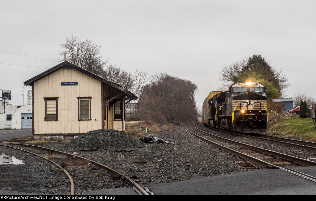 NS 4416 leads westbound empty auto racks past the ex-Reading Company depot in Mertztown, PA